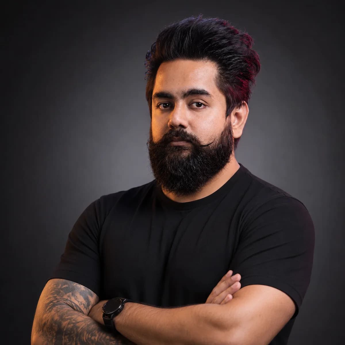 Real photo of Vishal Nigam in a black t-shirt, arms crossed